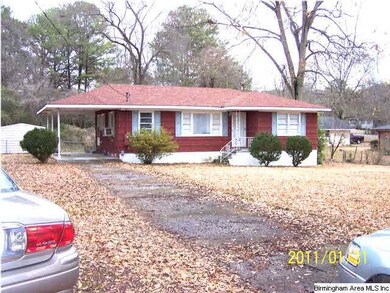 Home has concrete dr. and attached carport for you