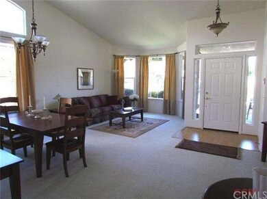 Bright, open living room with formal dining area.