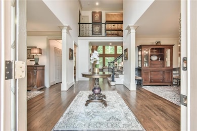 Entrance foyer with ornate columns, wood finished 