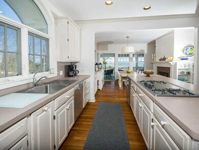 Kitchen. Arched window over the sink lets in loads