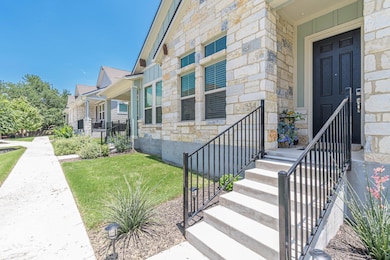 Doorway to property with stone siding