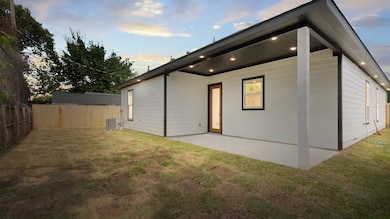 This photo showcases a modern home's backyard with
