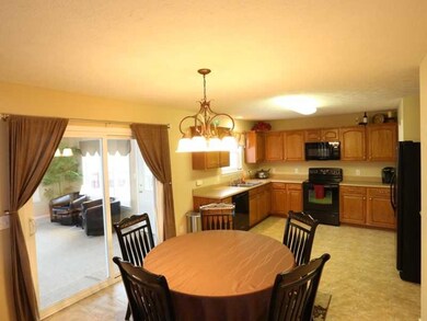 Other. A view of the kitchen, breakfast room and adjoining three season sun room.