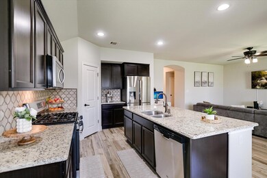 Kitchen featuring a sink, stainless steel applian
