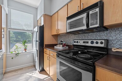 Kitchen featuring stainless steel appliances, dar