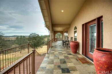 Over 1,100sf of covered, wrap-around slate tile po