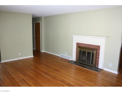 Fireplace and beautiful hardwood floors in Living 