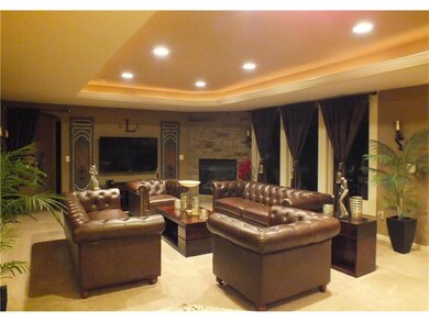 Family room with stone fireplace.