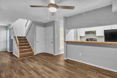 Dining area looking over kitchen pass through bar