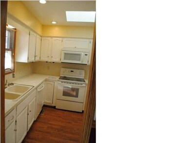 Can lighting surrounds skylight.