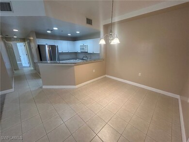 Kitchen with freestanding refrigerator, white micr