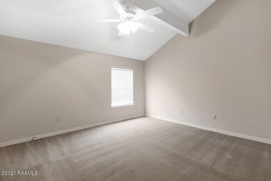Upstairs bedroom with vaulted ceilings.