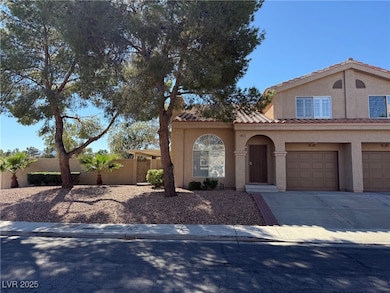 Mediterranean / spanish home featuring stucco siding, a garage, driveway, and a tile roof