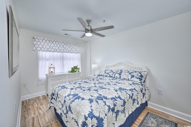 Bedroom featuring visible vents, baseboards, ceili