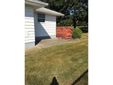 This wonderful ranch has a deck and concrete patio