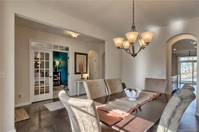 Spacious dining room with view of entrance, office