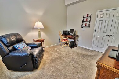Vaulted ceilings, ceiling fan with light and double doors at entry.