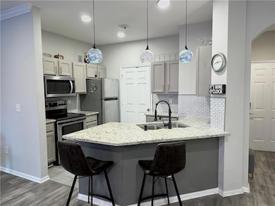 Renovated Kitchen with double sink, a kitchen bar,