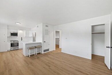 Kitchen featuring stainless steel appliances, whi