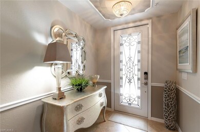 Entrance foyer featuring light tile patterned floo