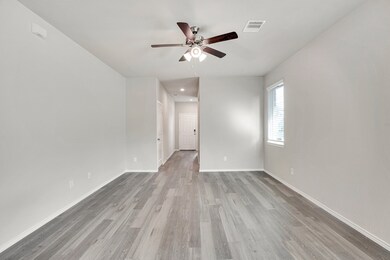 Main entrance hallway leads to living area.