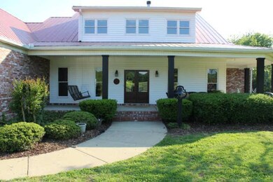 Sit, relax and enjoy the wrap around porch. 