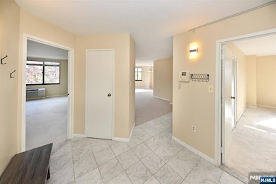 VIEW TO BEDROOMS AND LIVINGROOM FROM ENTRY