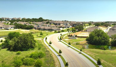 Aerial view of residential area featuring a large body of water