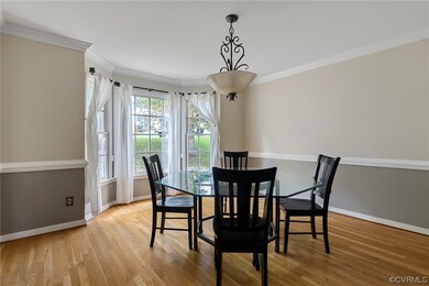 Dining space with light hardwood / wood-style floo