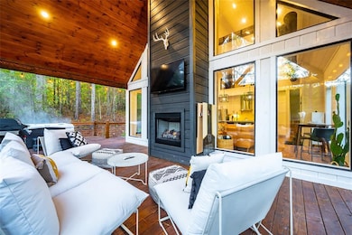 Expansive back covered patio with fireplace overlo