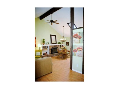 Open living area with vaulted ceilings and skyligh