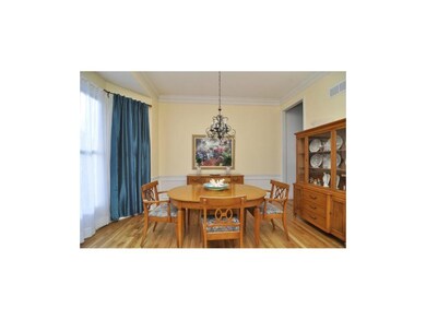 Lovely dining room with new hardwoods plus wainsco