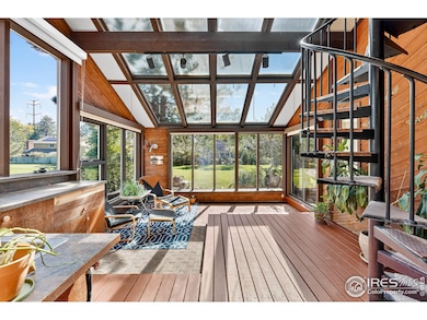 Vaulted ceilings, skylights, and southern-facing Marvin windows flood the main living areas with natural light.