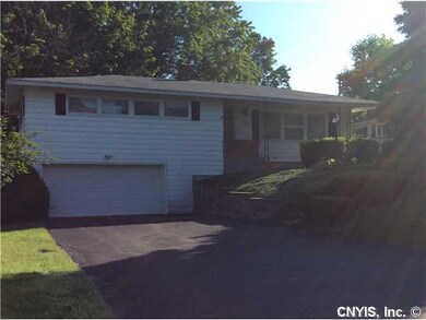 Exterior Front. Garage leads you to the partially 