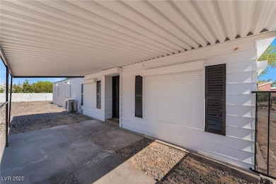 View of patio featuring fence