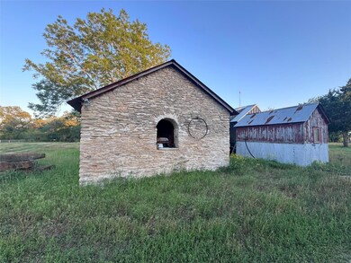 View of home's exterior featuring stone siding an