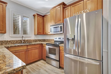 Kitchen featuring appliances with stainless steel 