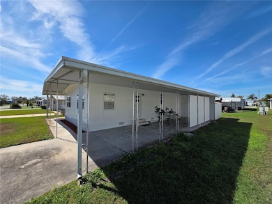 Driveway, carport, covered front walkway.
