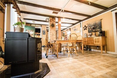 Dining room with pellet stove.
