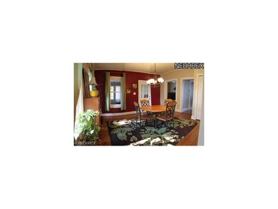 Lovely formal dining room with hardwood floors and