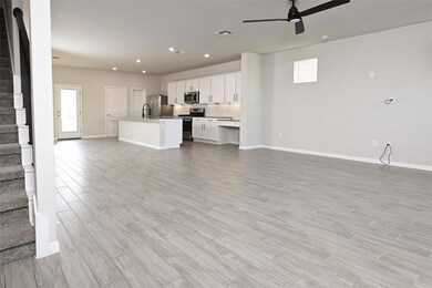 Unfurnished living room with stairway, a ceiling 
