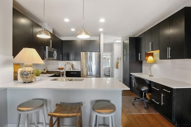 Kitchen featuring appliances with stainless steel