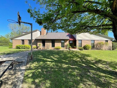 Ranch-style home with a front yard
