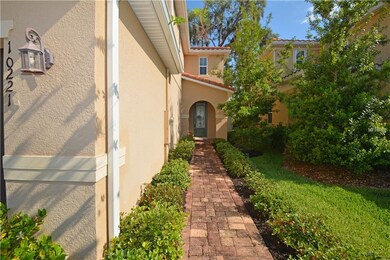 Paver walk to lead glass front door - manicured ya
