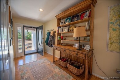 Welcoming front hall off of covered front entry
