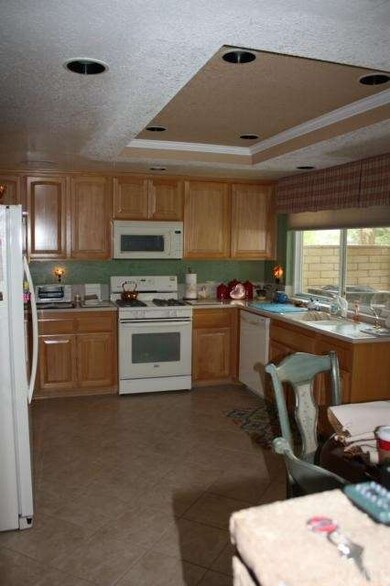 View showing recessed lighting and the kitchen win