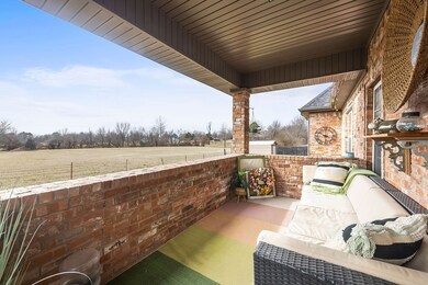 Backyard covered patio with brick enclosure.