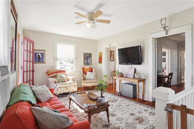 UPSTAIRS: Living room leads to a dining room and f