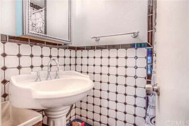 Honeycomb tile downstairs bathroom with newer pede