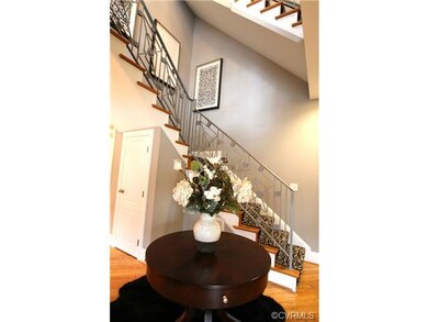 Open staircase with custom metal railing
